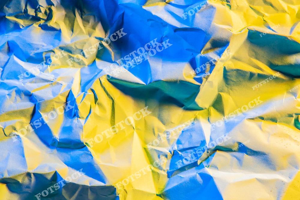 Изображение представляет собой текстурированный фон с абстрактным узором, включающий яркие синие и желтые цвета с элементами складок или волн. Цвета переходят друг в друга, создавая динамичное и визуально привлекательное сочетание.