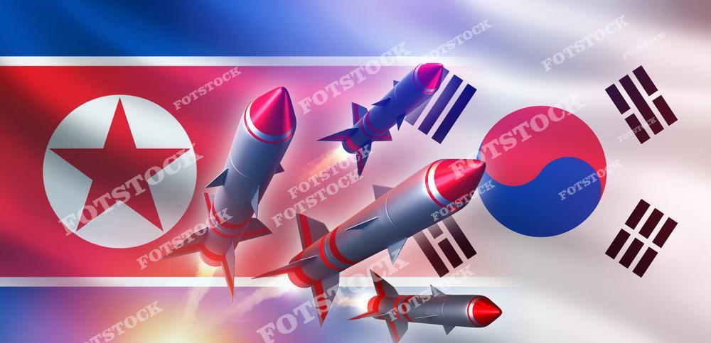 На изображении ракеты, запущенные на фоне флагов Северной и Южной Кореи. Композиция подчеркивает напряженность в отношениях между двумя странами и акцентирует внимание на военной угрозе.