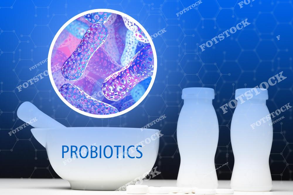 3D-иллюстрация с медицинской ступкой, надписью probiotics, белыми бутылочками и изображением микробиома символизирует современные пробиотические препараты и BIO-добавки для поддержания здоровья кишечника. Изображение отражает концепцию полезных бактерий, лактобактерий и биологических добавок, способствующих улучшению пищеварения, укреплению иммунитета и восстановлению микрофлоры организма. Визуализация подходит для публикаций о гастроэнтерологии, диетологии, wellness-индустрии и правильном питании. Фото можно использовать для рекламы пробиотиков, аптек, медицинских сайтов, брендов здорового питания и фармацевтических компаний. Иллюстрация подчеркивает современные технологии производства пробиотических препаратов и заботу о здоровье человека.